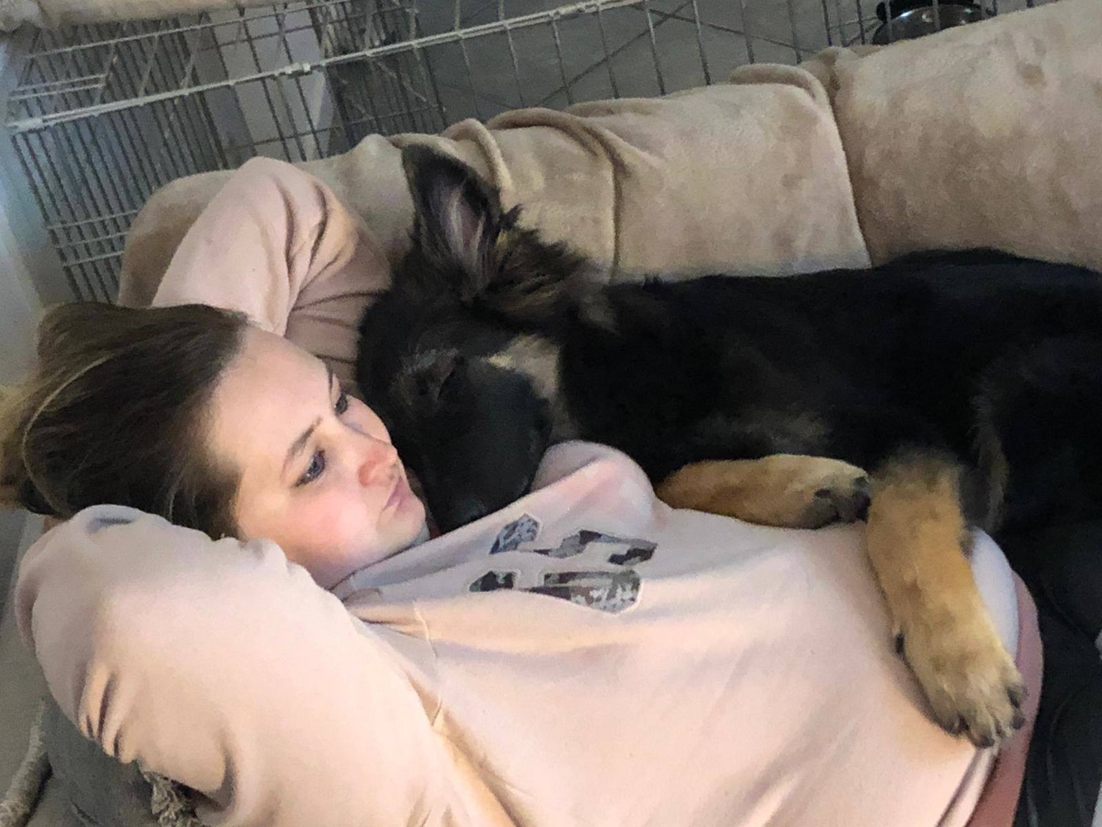 Melissa cuddling Arya on the sofa