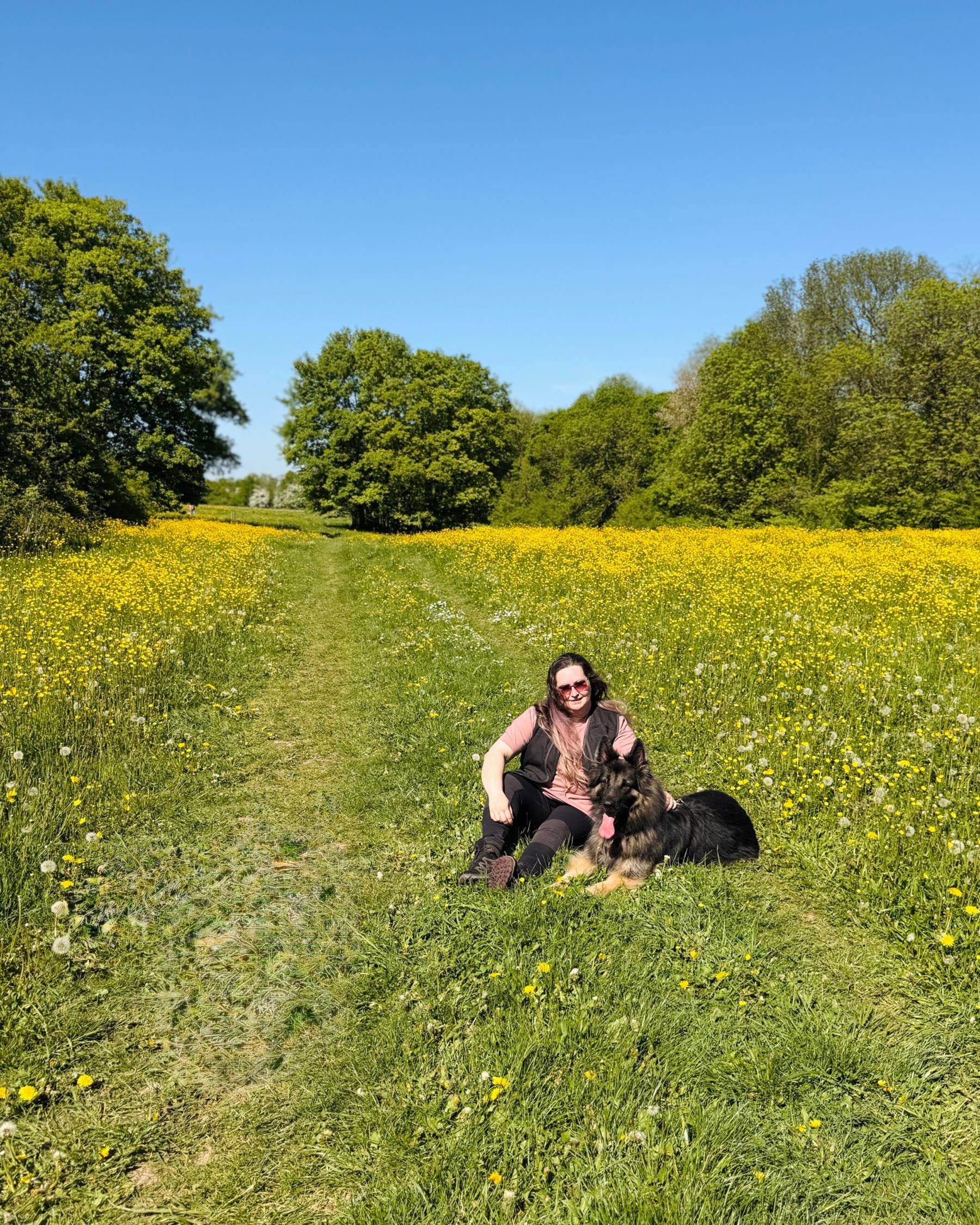 Melissa and Arya in a meadow full of buttercups