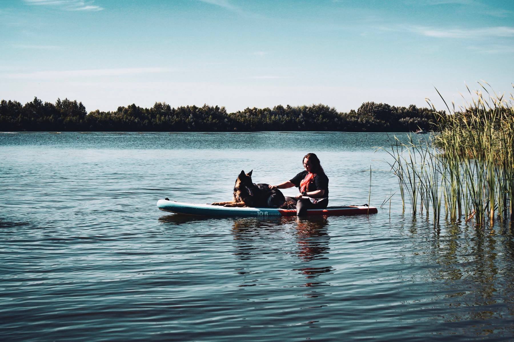 Paddle-boarding with Arya on a still lake