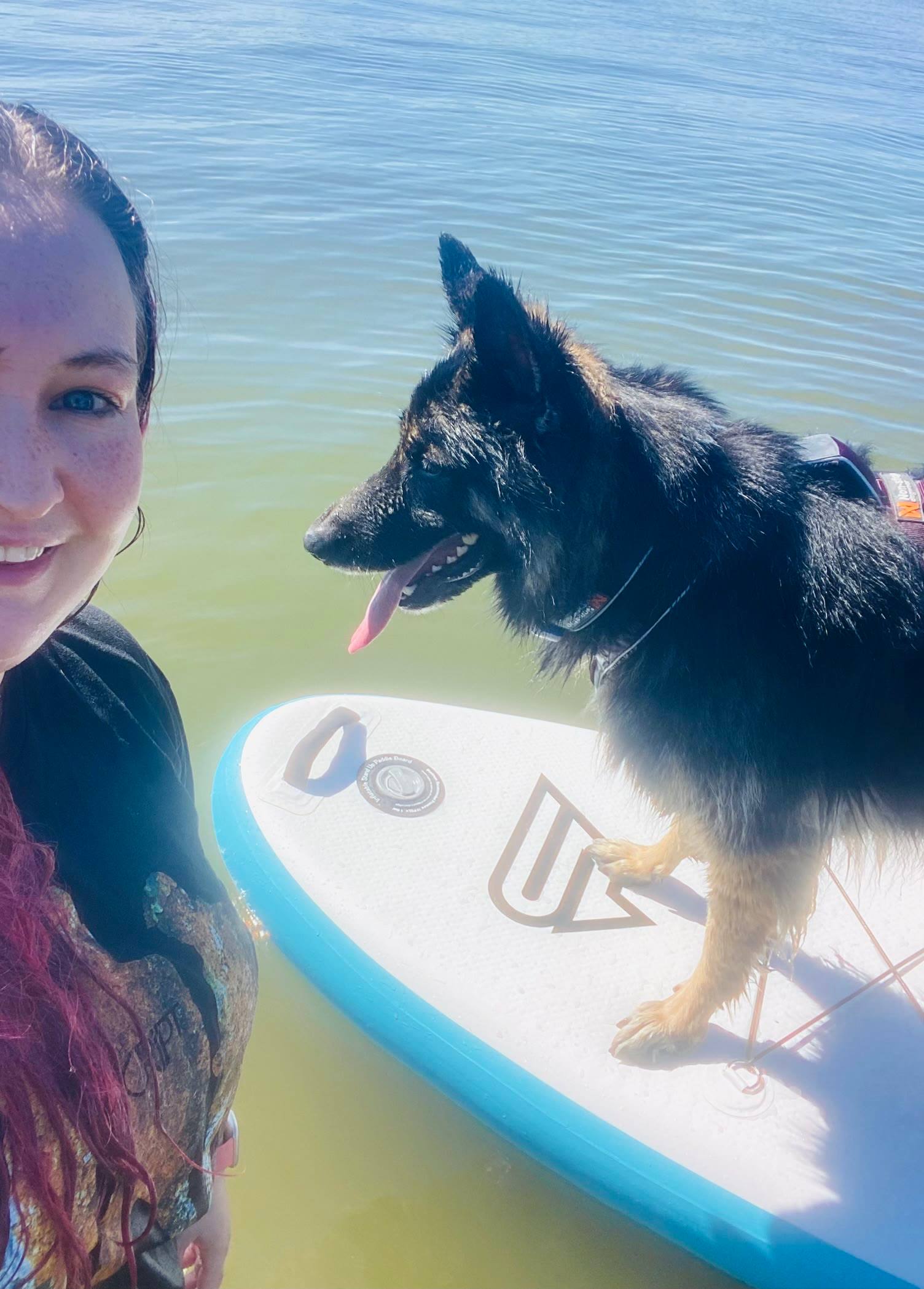 A selfie of Melissa and Arya on a paddle board