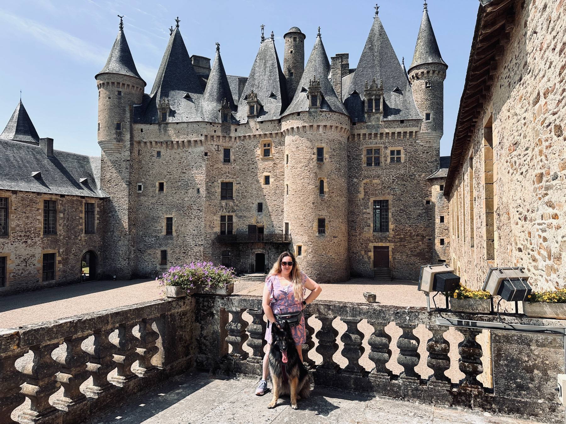 Melissa and Arya on the terrace of a French château with pointed slate towers